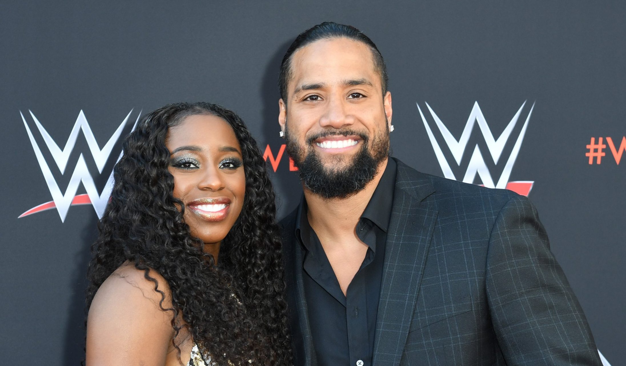Naomi, WWE star, is expecting a child while giving up her world title.